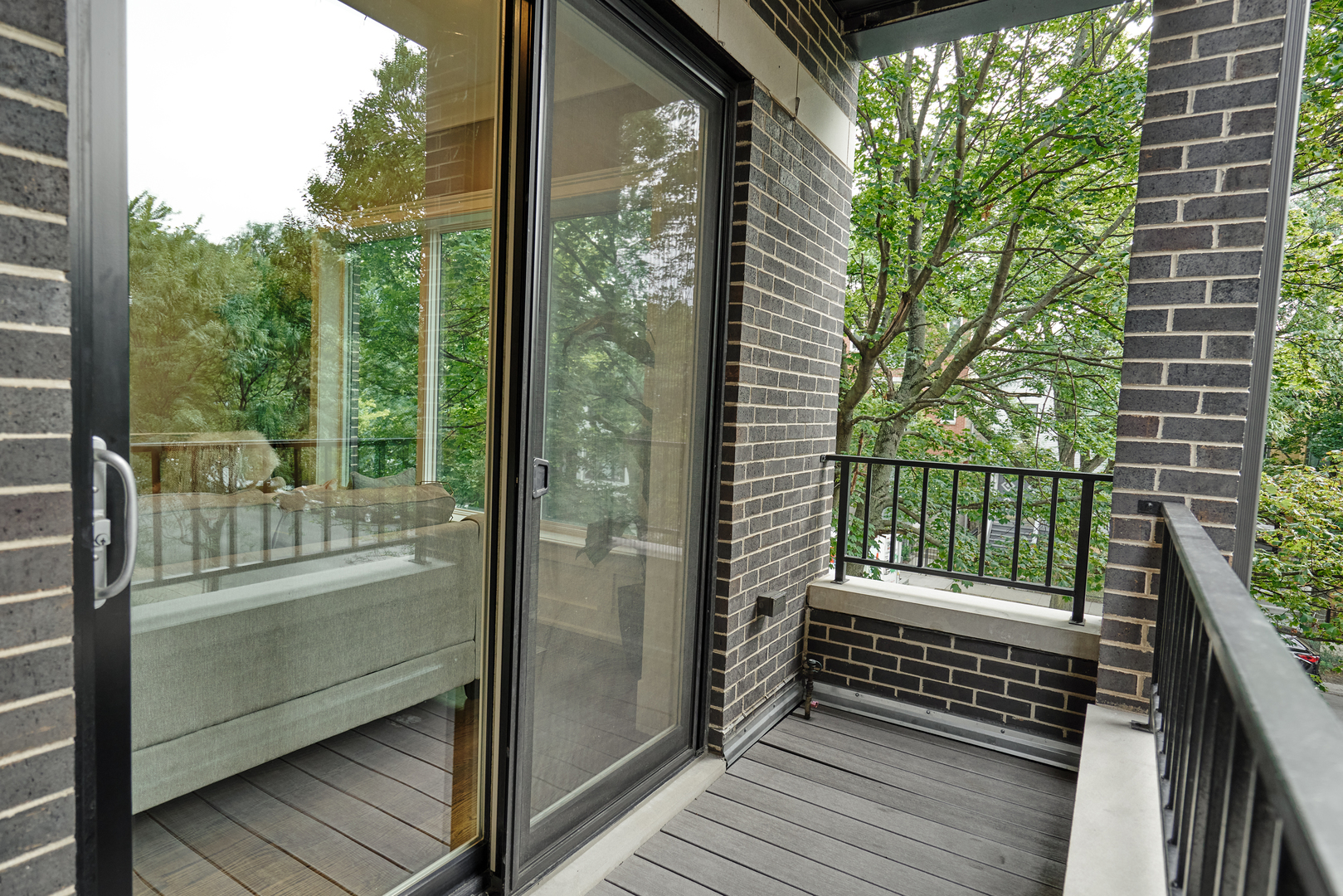 3044 North Racine Avenue, Unit 2 Chicago, IL 60657 - Photo 11 of 27 a view of a balcony with floor to ceiling window wooden floor