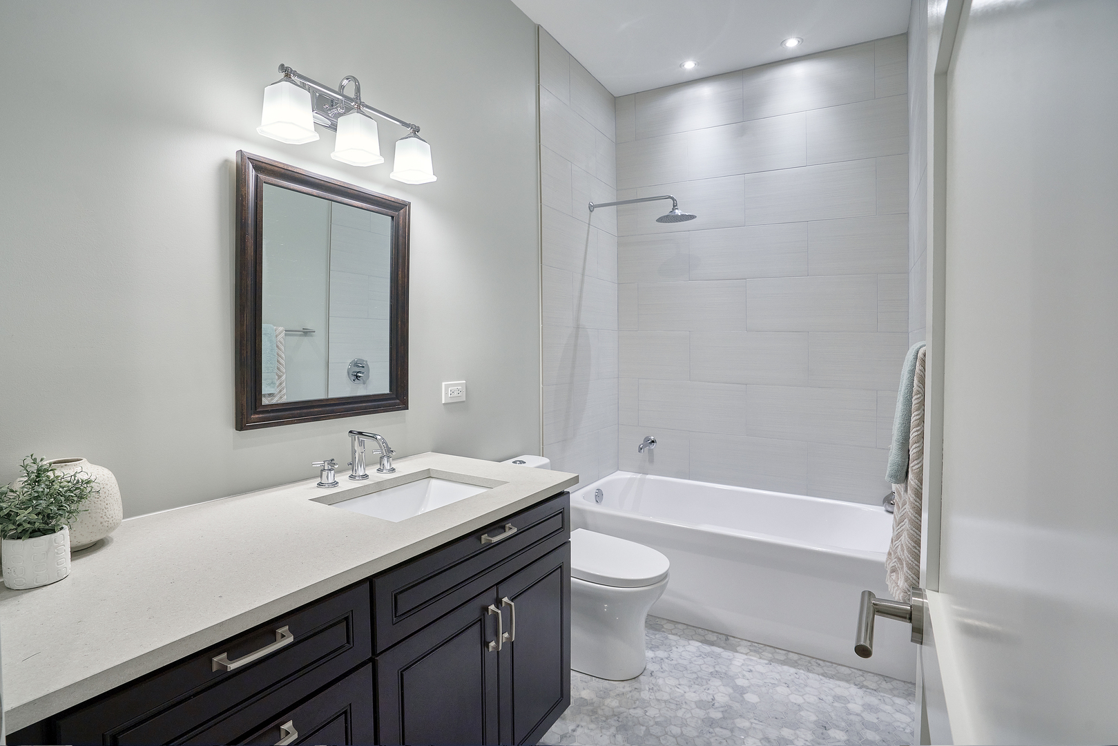 3044 North Racine Avenue, Unit 2 Chicago, IL 60657 - Photo 13 of 27 a bathroom with a sink a toilet and shower