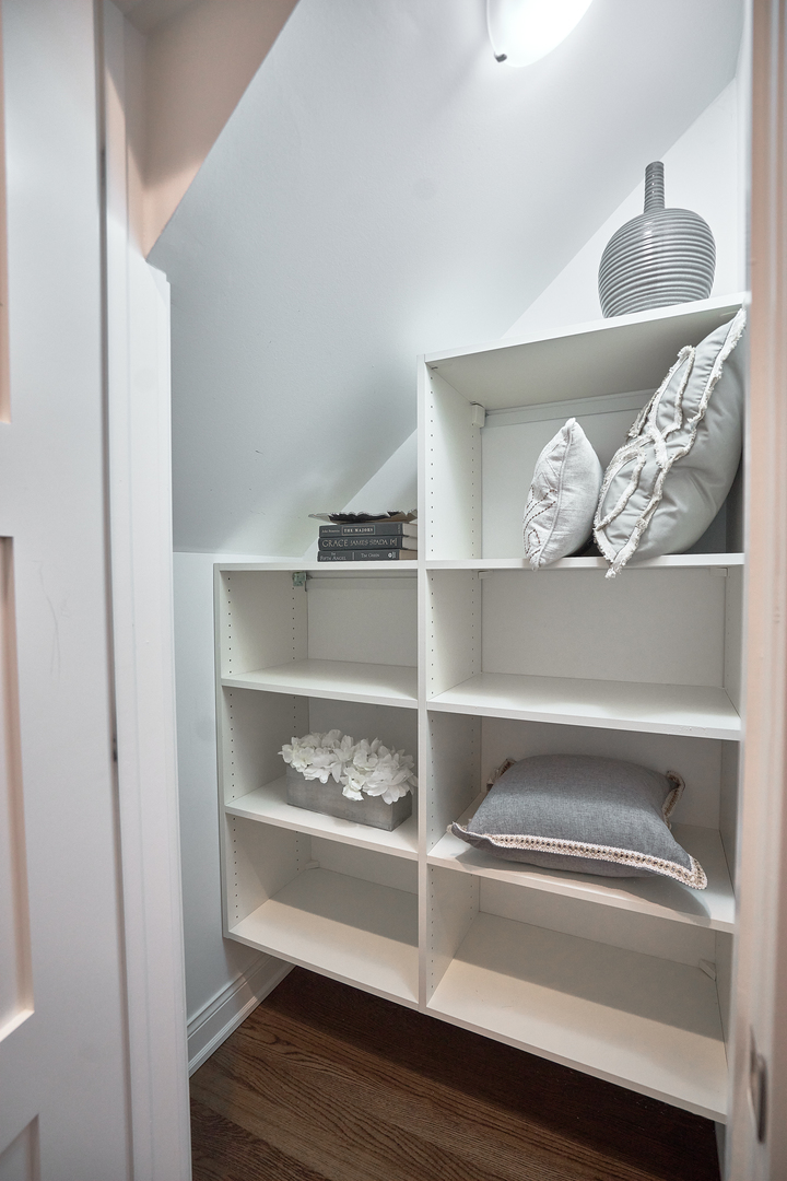 3044 North Racine Avenue, Unit 2 Chicago, IL 60657 - Photo 15 of 27 a shelf with books and a shelf with wooden floor