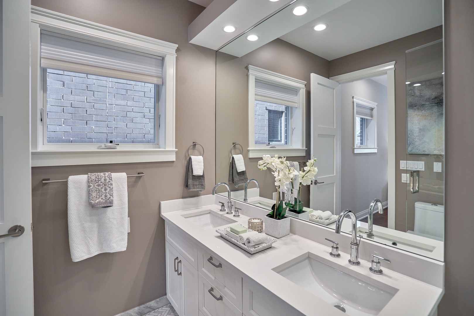 3044 North Racine Avenue, Unit 2 Chicago, IL 60657 - Photo 18 of 27 a bathroom with a sink double vanity granite and a mirror