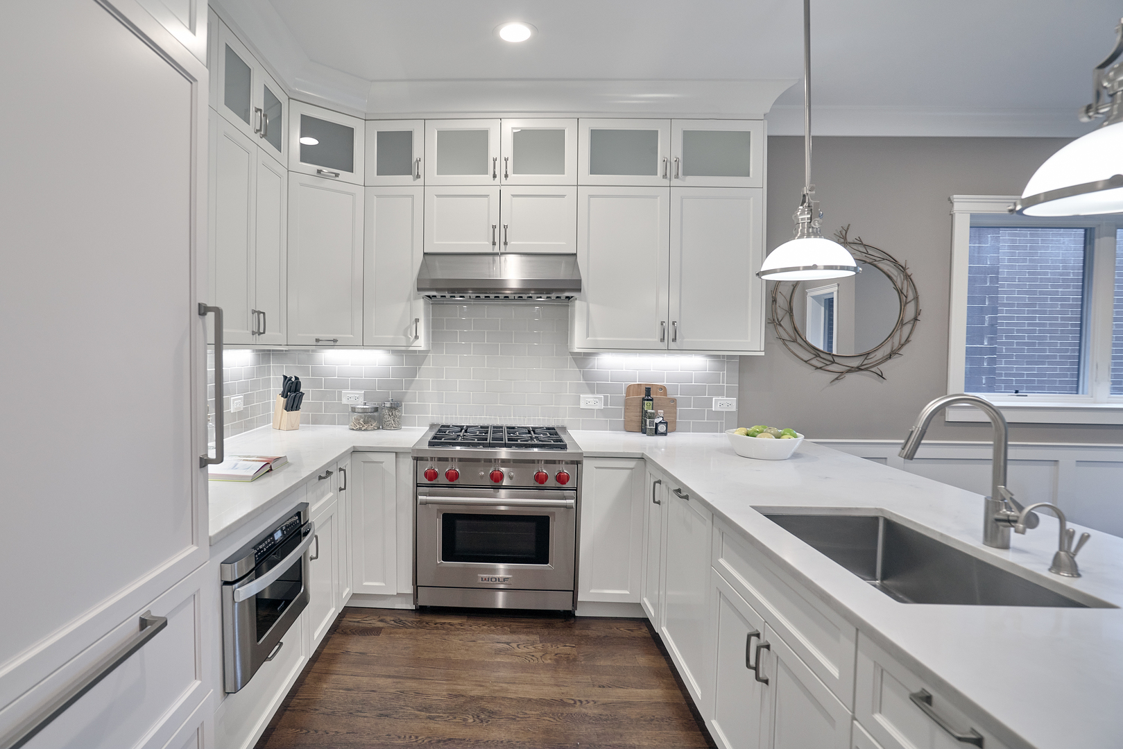 3044 North Racine Avenue, Unit 2 Chicago, IL 60657 - Photo 3 of 27 a kitchen with stainless steel appliances a stove and white cabinets
