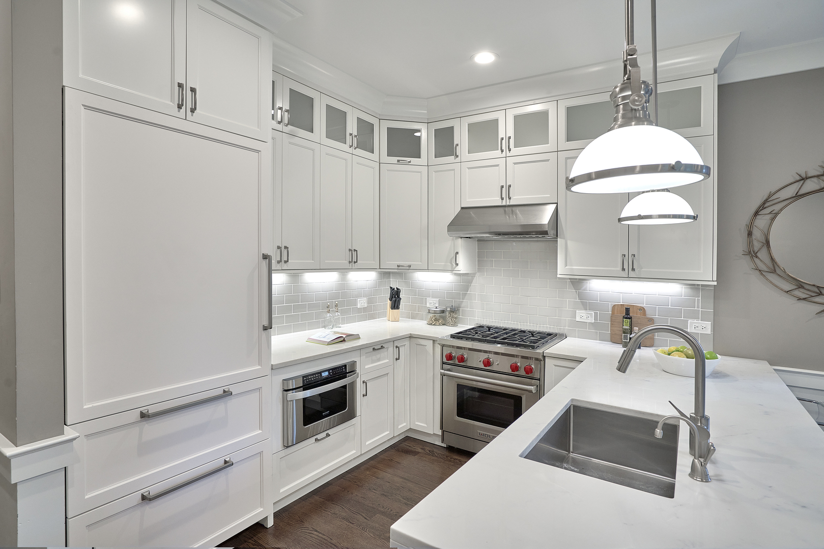 3044 North Racine Avenue, Unit 2 Chicago, IL 60657 - Photo 5 of 27 a kitchen with a stove and white cabinets