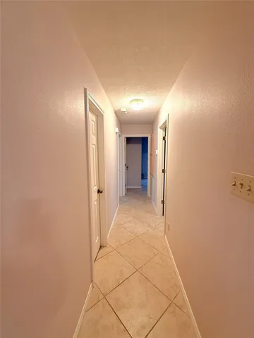 a view of a hallway with a white walls