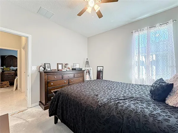 a bathroom with a granite countertop sink a mirror and a shower