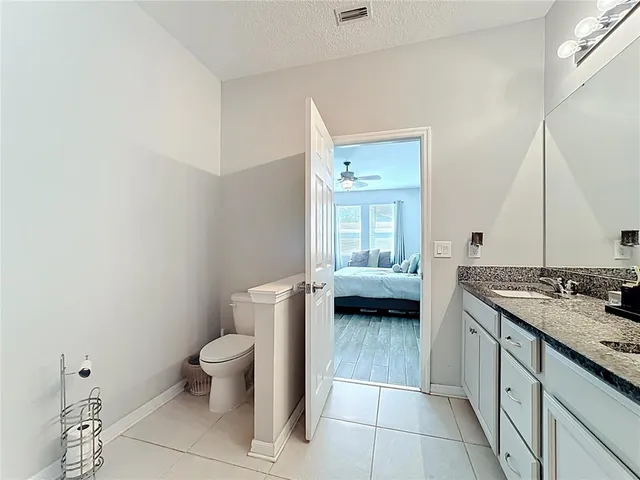 a kitchen with stainless steel appliances granite countertop a stove and a microwave