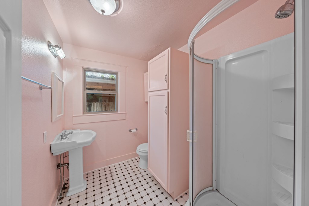 1209 Park Street Kerrville, TX 78028 - Photo 12 of 28 a bathroom with a sink and a mirror