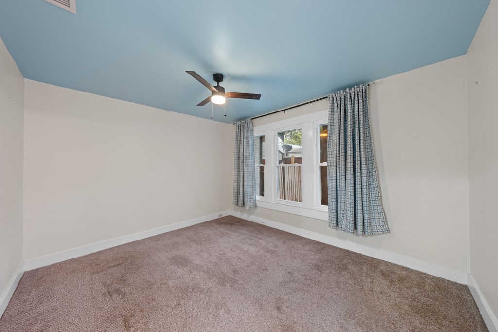 1209 Park Street Kerrville, TX 78028 - Photo 16 of 28 a view of an empty room with a window