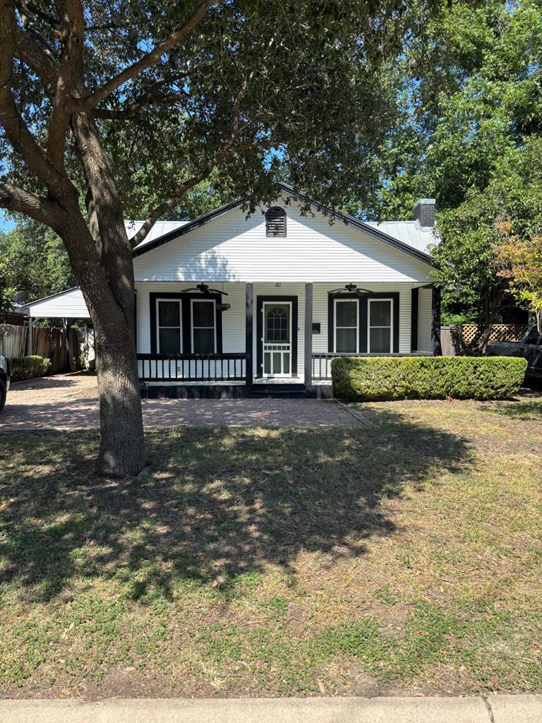 1209 Park Street Kerrville, TX 78028 - Photo 2 of 28 a front view of a house with a yard