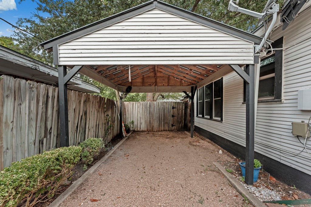 1209 Park Street Kerrville, TX 78028 - Photo 28 of 28 a view of a white house with a small yard and potted plants