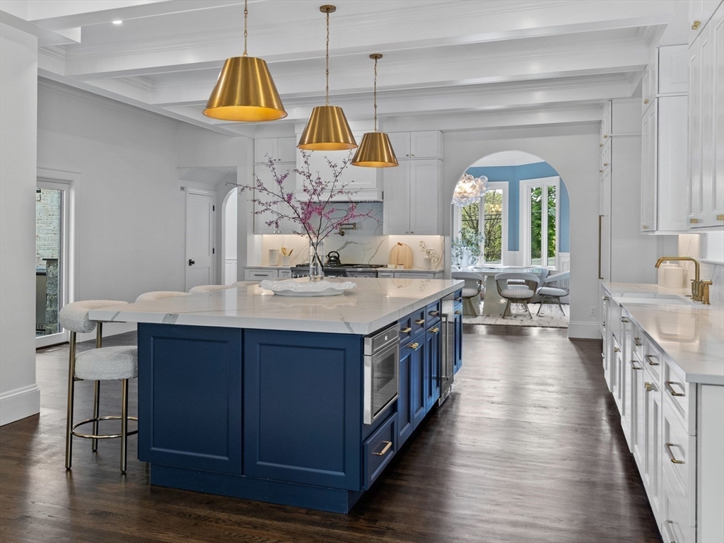 3 Myopia Road Winchester, MA 01890 - Photo 11 of 42 a kitchen with kitchen island granite countertop a sink a stove and a wooden floors