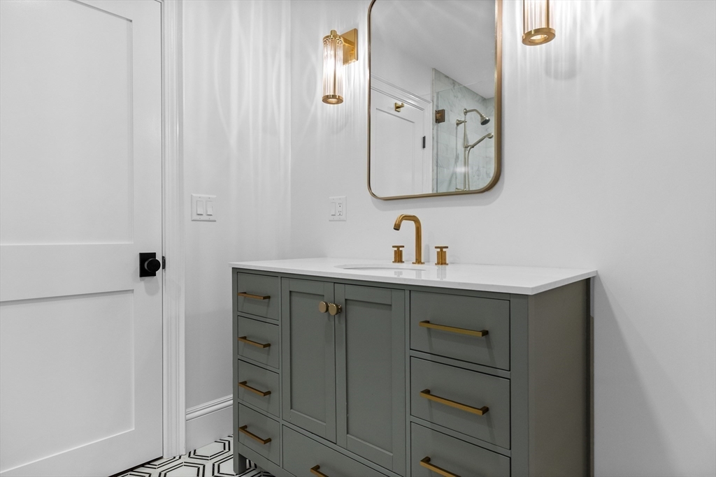 3 Myopia Road Winchester, MA 01890 - Photo 36 of 42 a bathroom with a mirror sink and vanity