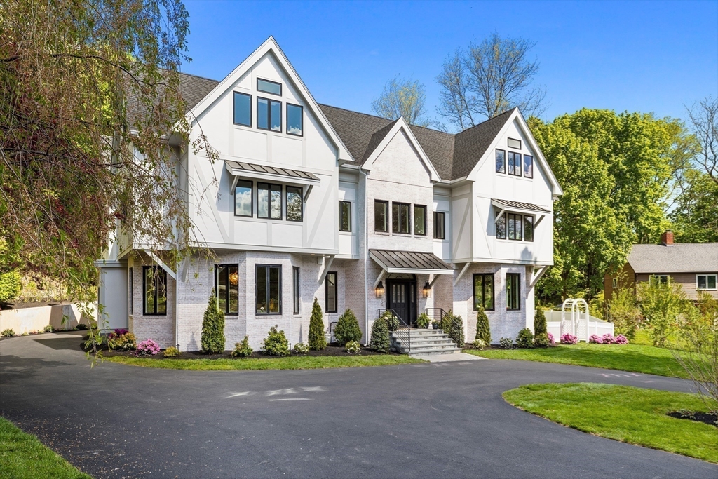 3 Myopia Road Winchester, MA 01890 - Photo 6 of 42 a front view of a house with a yard and garage
