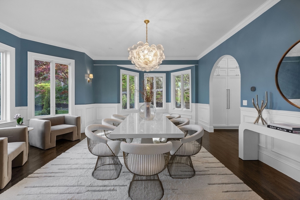 3 Myopia Road Winchester, MA 01890 - Photo 8 of 42 a view of a dining room with furniture a chandelier and wooden floor