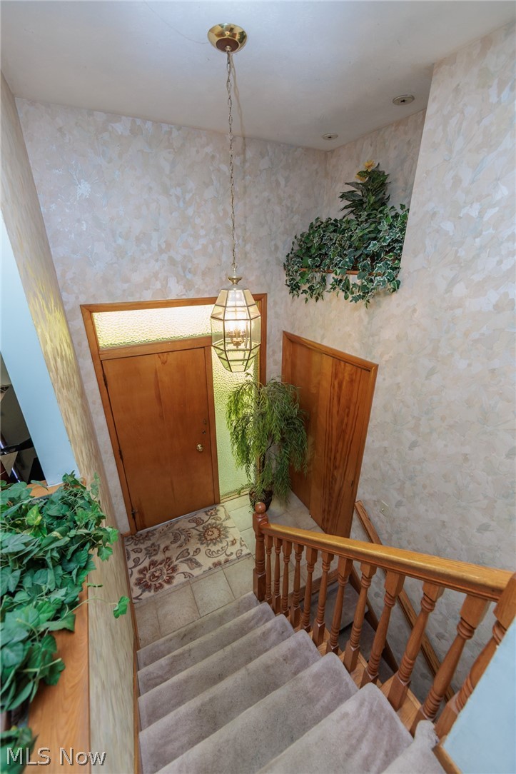 2170 Norton Road Stow, OH 44224 - Photo 21 of 48 Carpeted staircase with wood banister and balusters