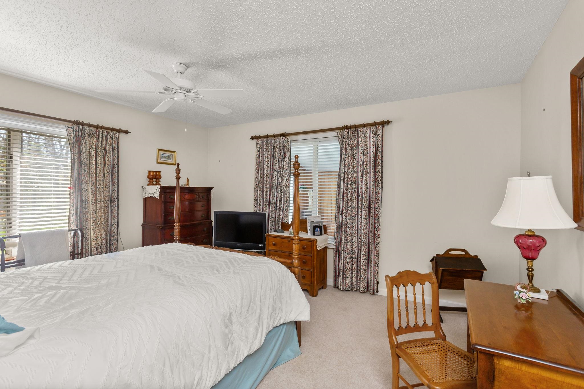 13004 Indian Trail Road Broadway, VA 22815 - Photo 35 of 56 a bedroom with a bed and furniture