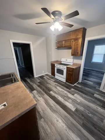 a kitchen with a stove and a microwave