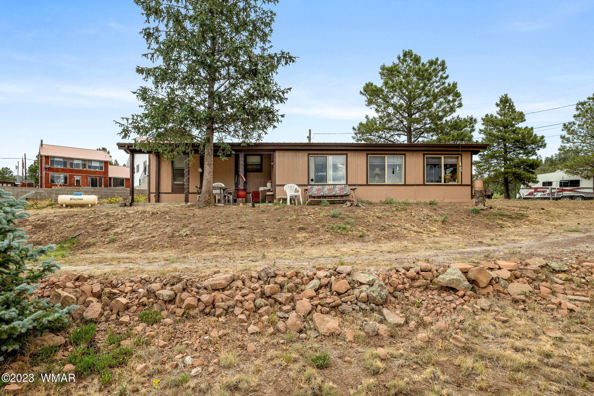 20 County Road 2140 Alpine, AZ 85920 - Photo 13 of 32 a backyard of a house with yard and outdoor seating