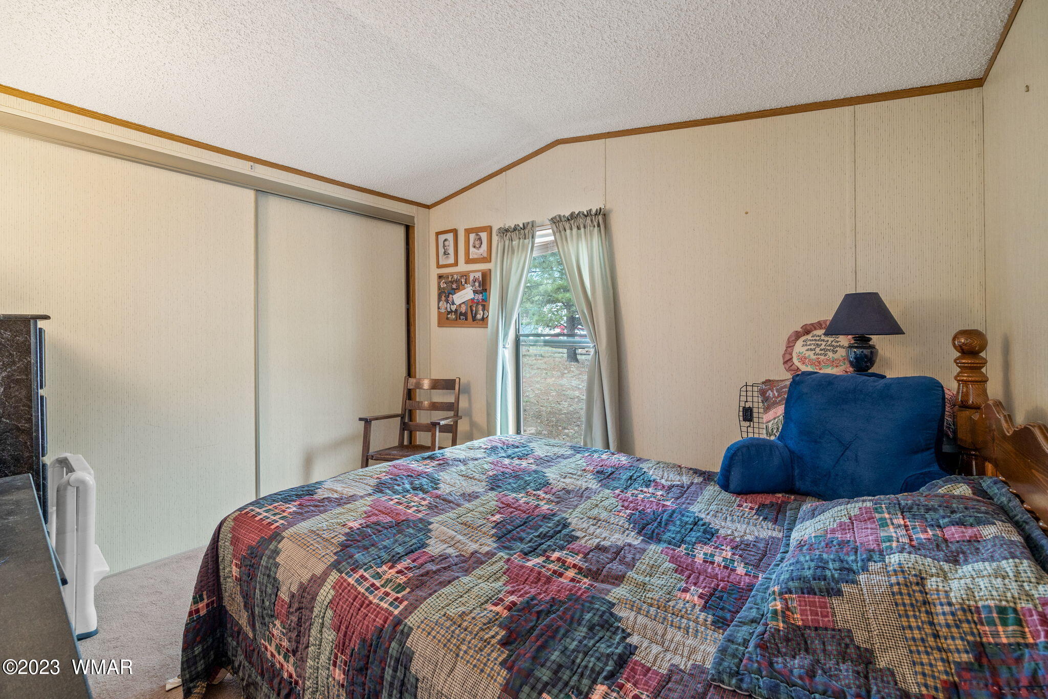 20 County Road 2140 Alpine, AZ 85920 - Photo 21 of 32 a bedroom with a bed and a window