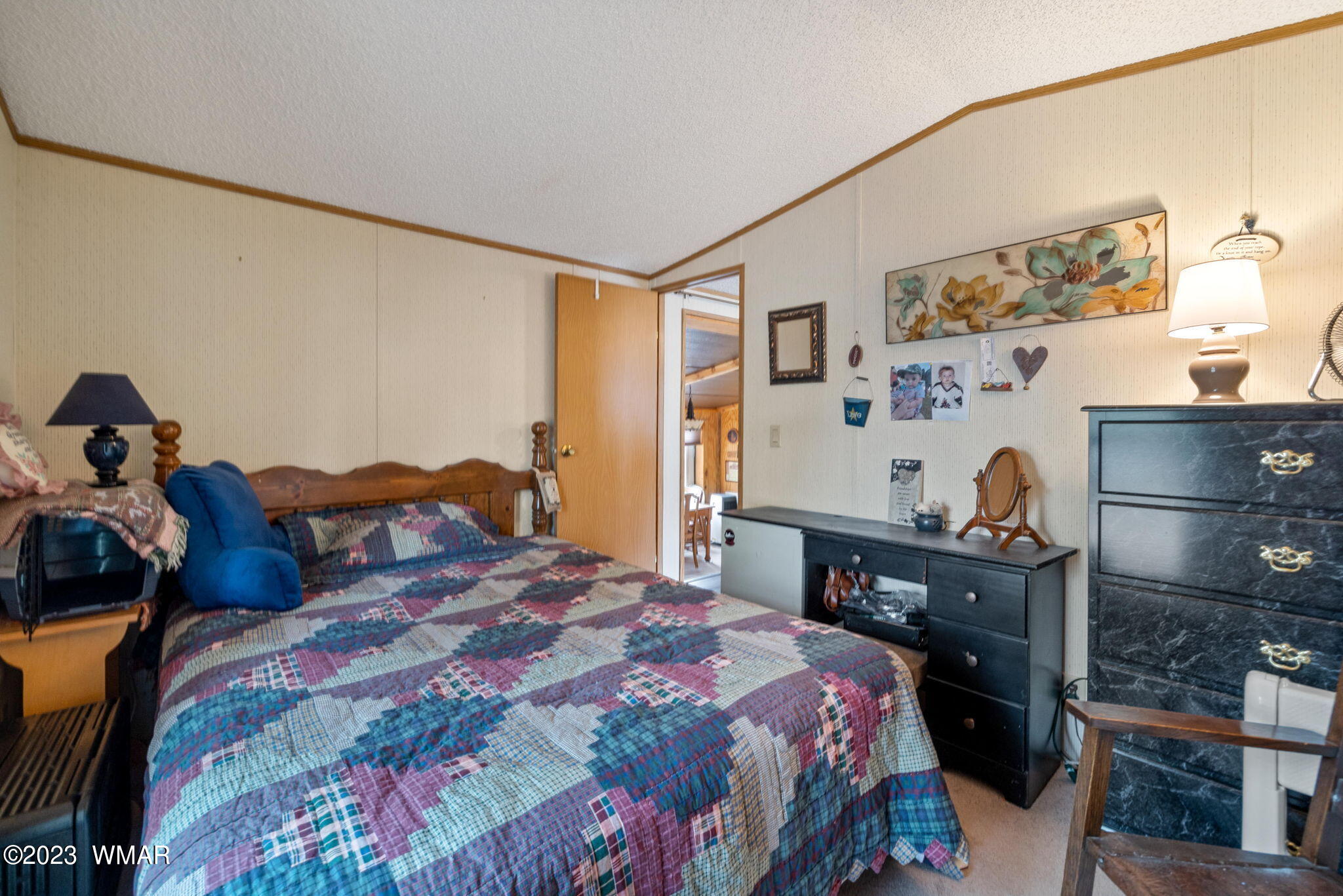 20 County Road 2140 Alpine, AZ 85920 - Photo 22 of 32 a bedroom with a bed and a dresser