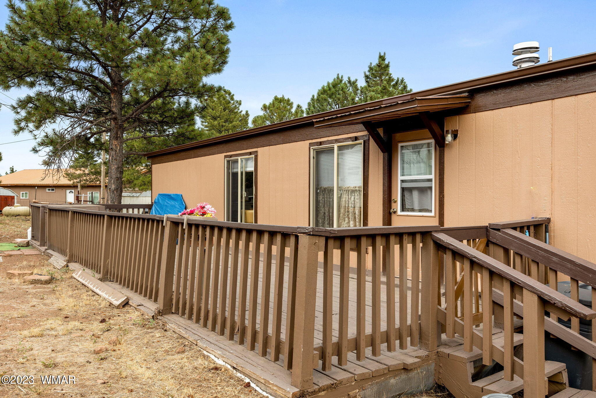 20 County Road 2140 Alpine, AZ 85920 - Photo 24 of 32 a front view of a house with wooden fence