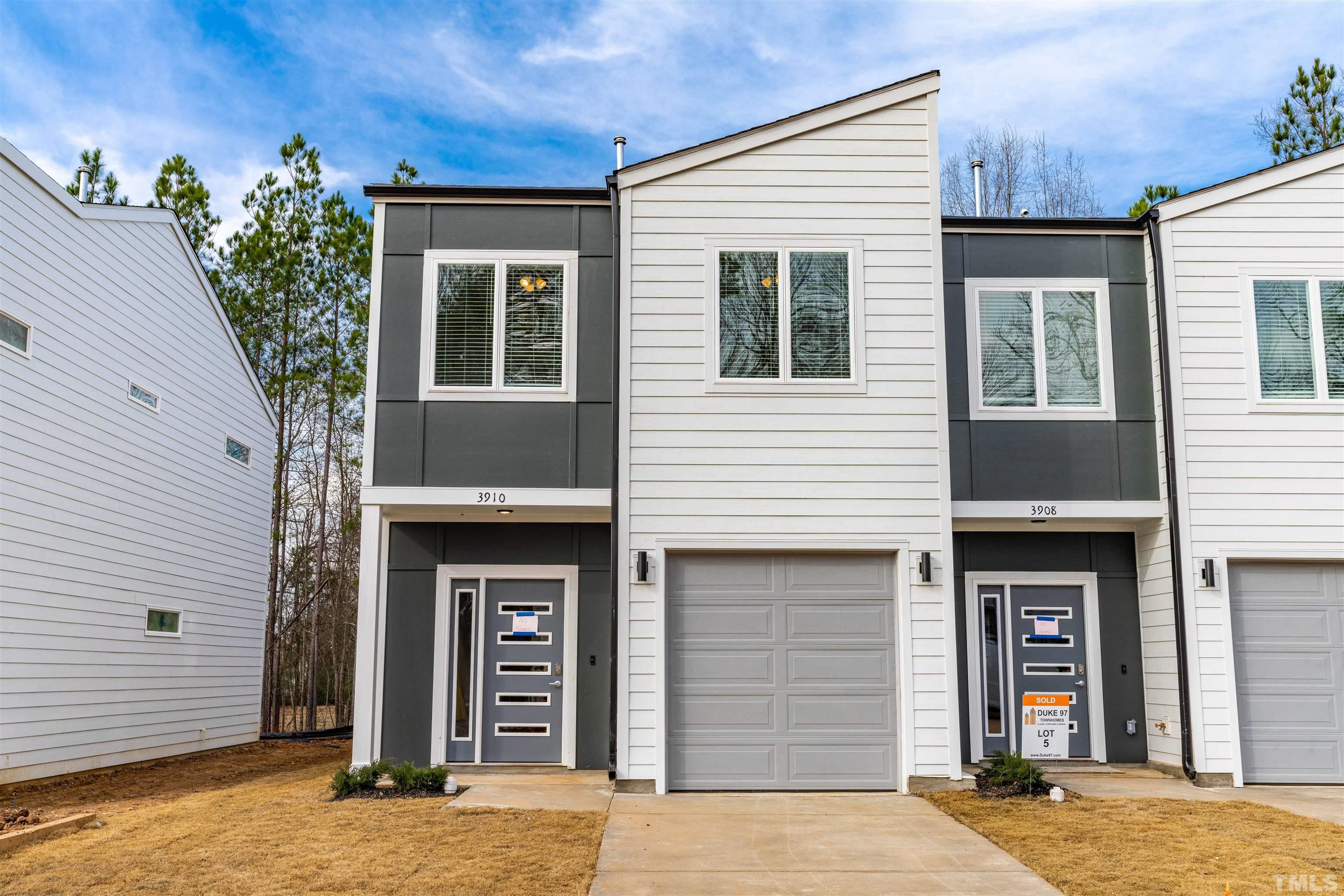3916 Convergence Street Durham, NC 27704 - Photo 4 of 34 a front view of a house with glass windows