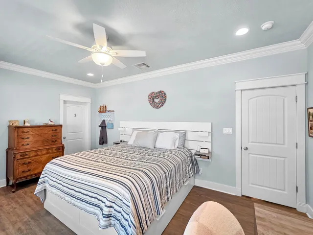 a spacious bathroom with a granite countertop sink mirror and a toilet