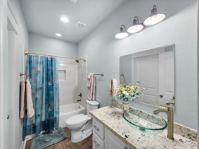 a bathroom with a shower curtain