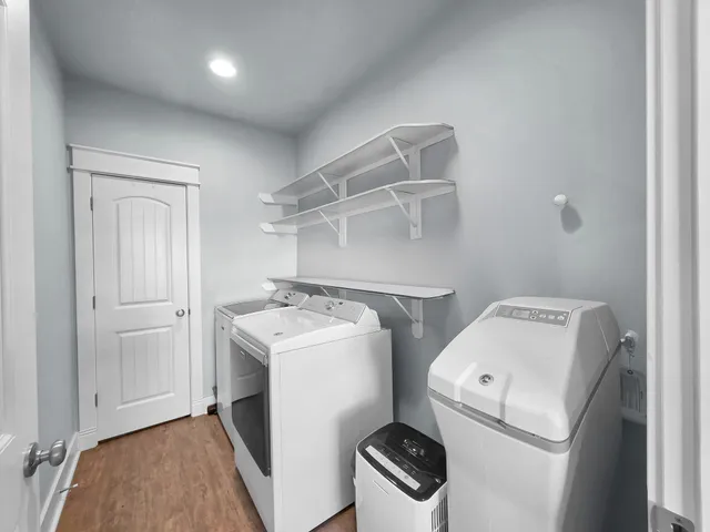 a bath tub sitting next to a white sink