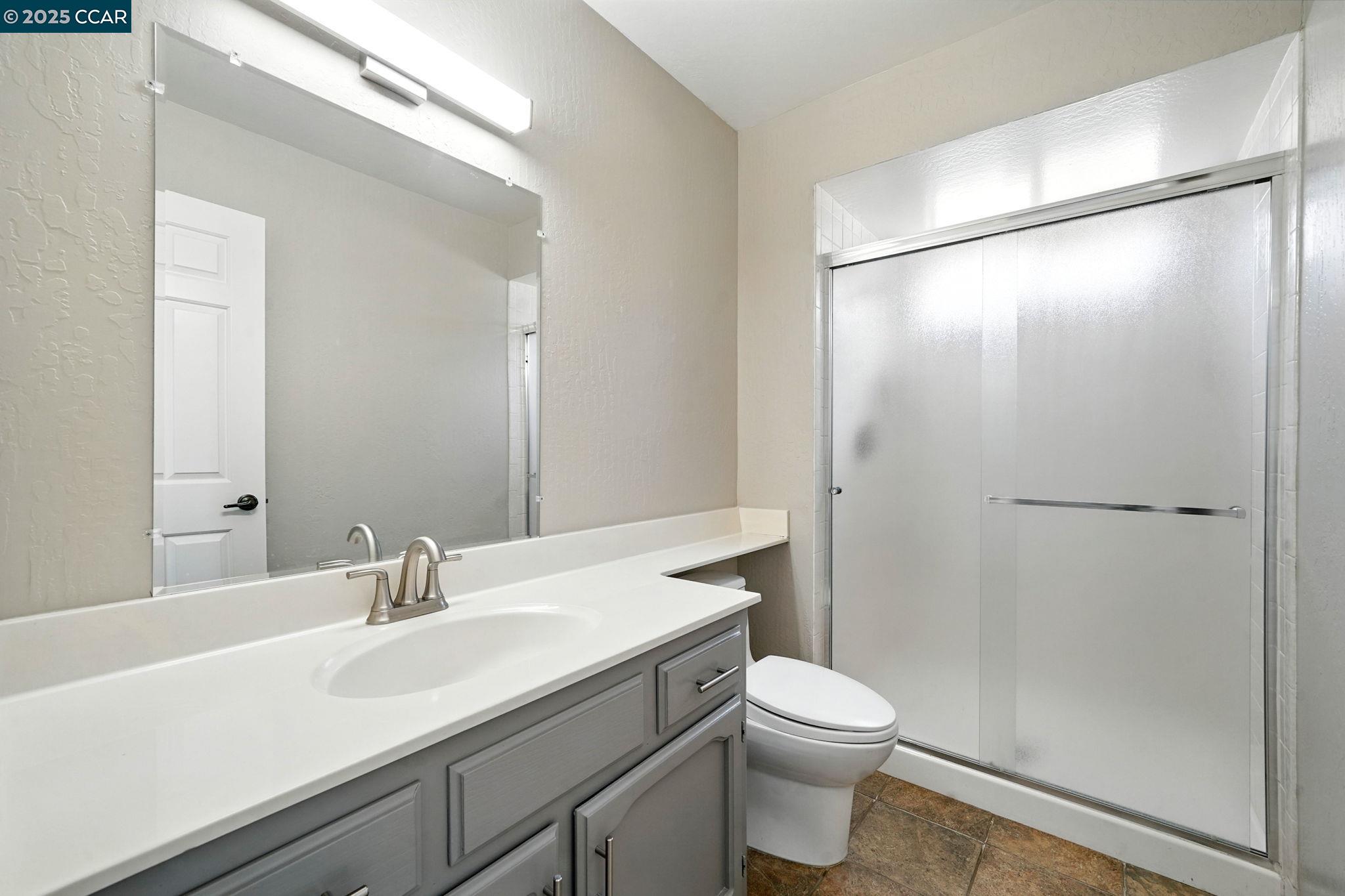 267 Duperu Drive Crockett, CA 94525 - Photo 24 of 50 a bathroom with a sink a toilet a mirror and shower