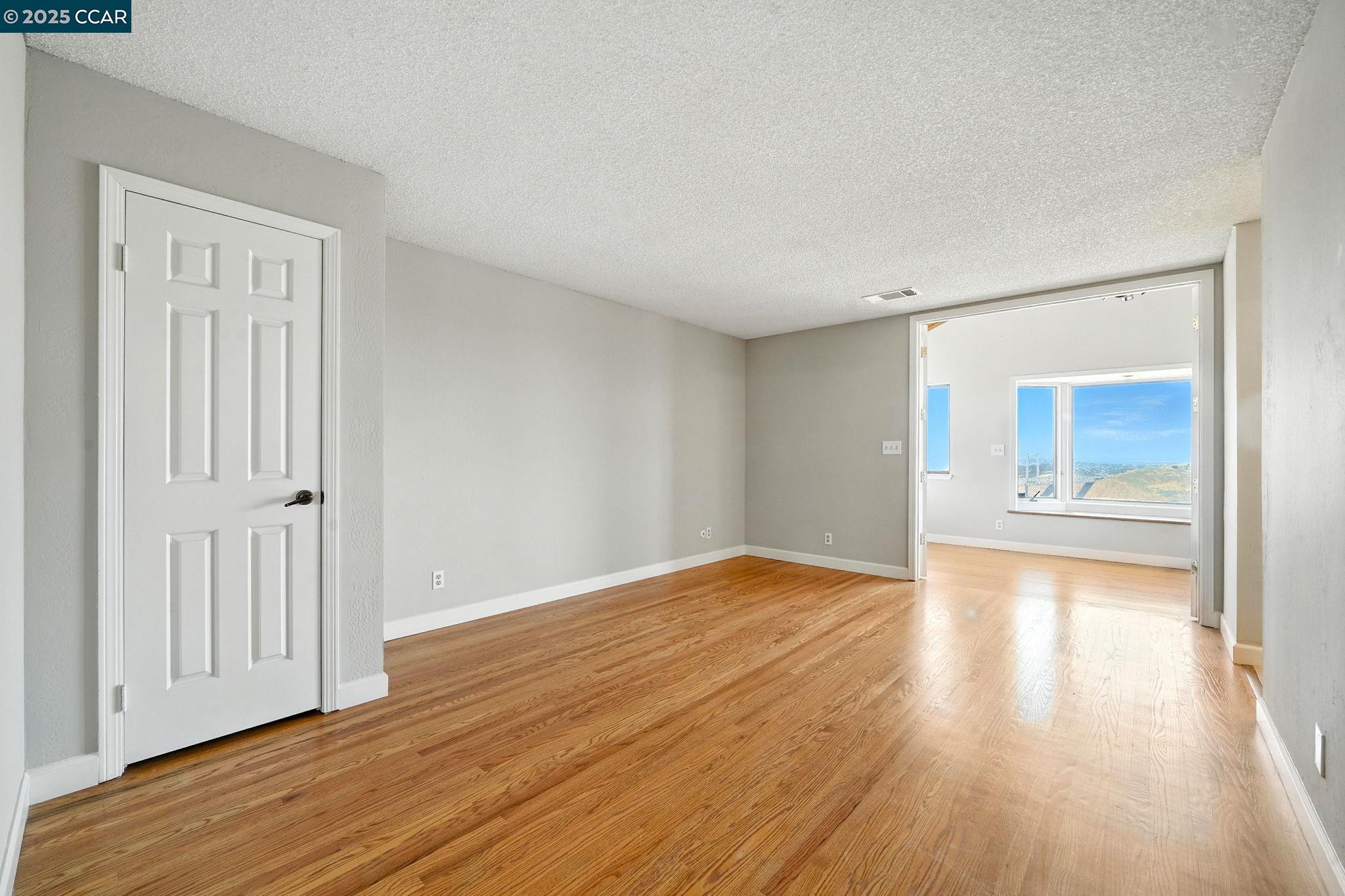 267 Duperu Drive Crockett, CA 94525 - Photo 32 of 50 a view of empty room with wooden floor