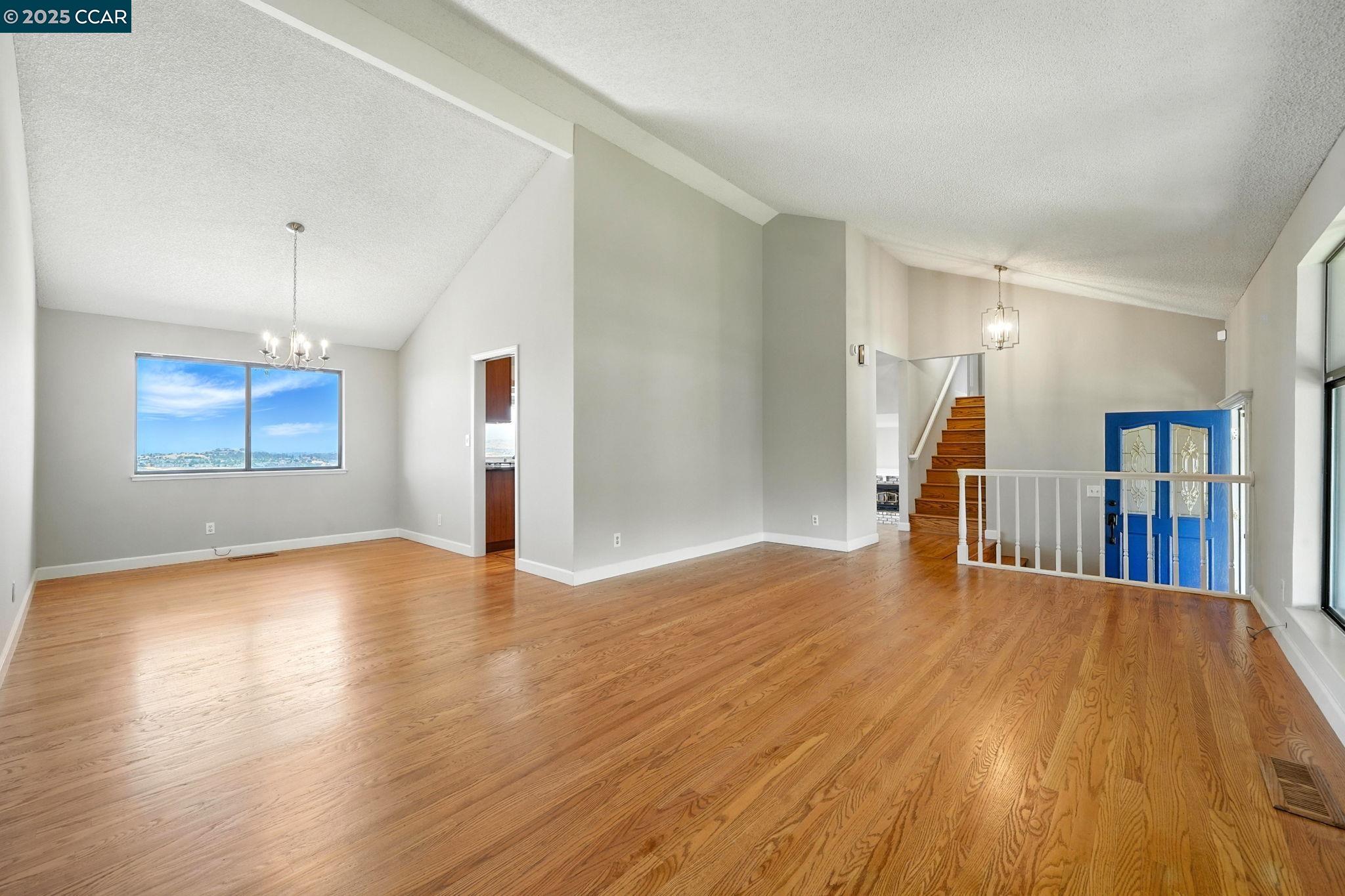 267 Duperu Drive Crockett, CA 94525 - Photo 6 of 50 a view of empty room with wooden floor and window