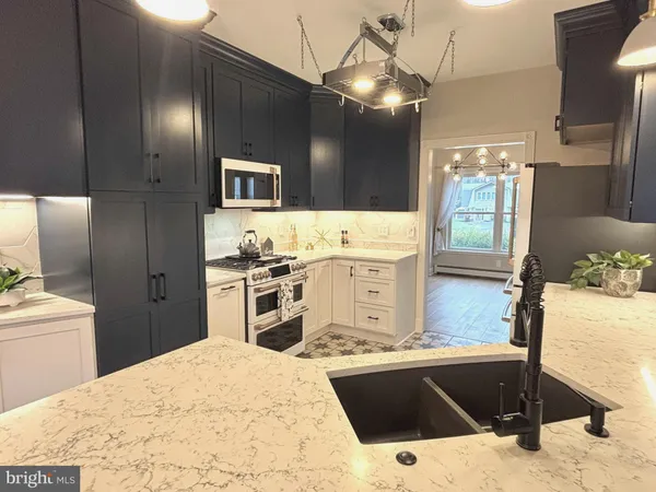 a living room with a fireplace cabinet and a fireplace