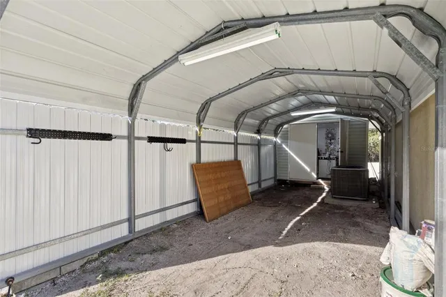 a view of a livingroom with wooden floor and furniture