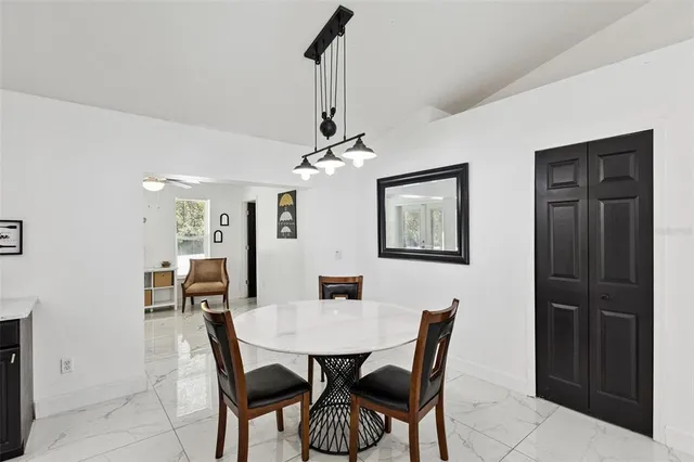 a view of a dining room with furniture