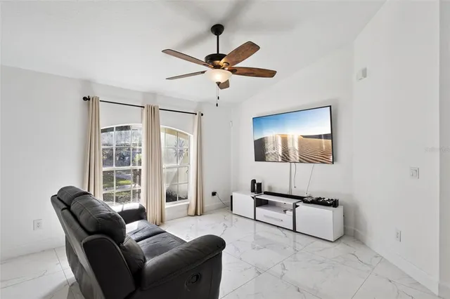 a living room with furniture and a window