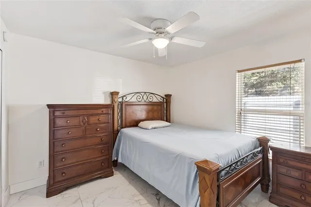 a bedroom with a bed and a dresser