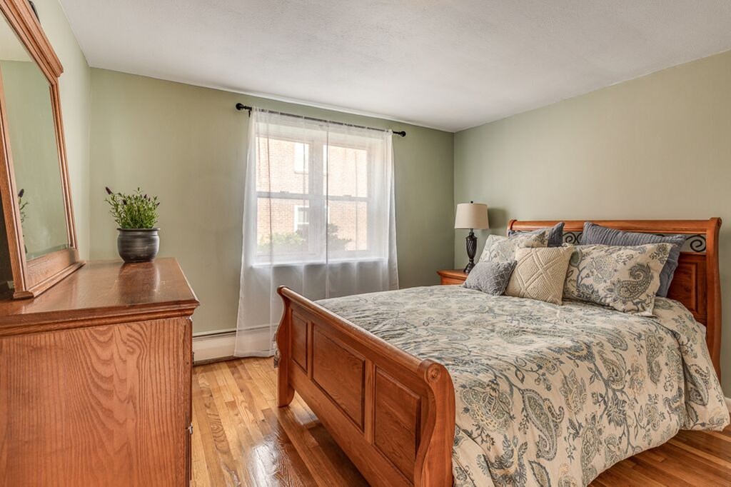 51 Colborne Road, Unit 3 Boston, MA 02135 - Photo 7 of 12 a bedroom with a bed and a window