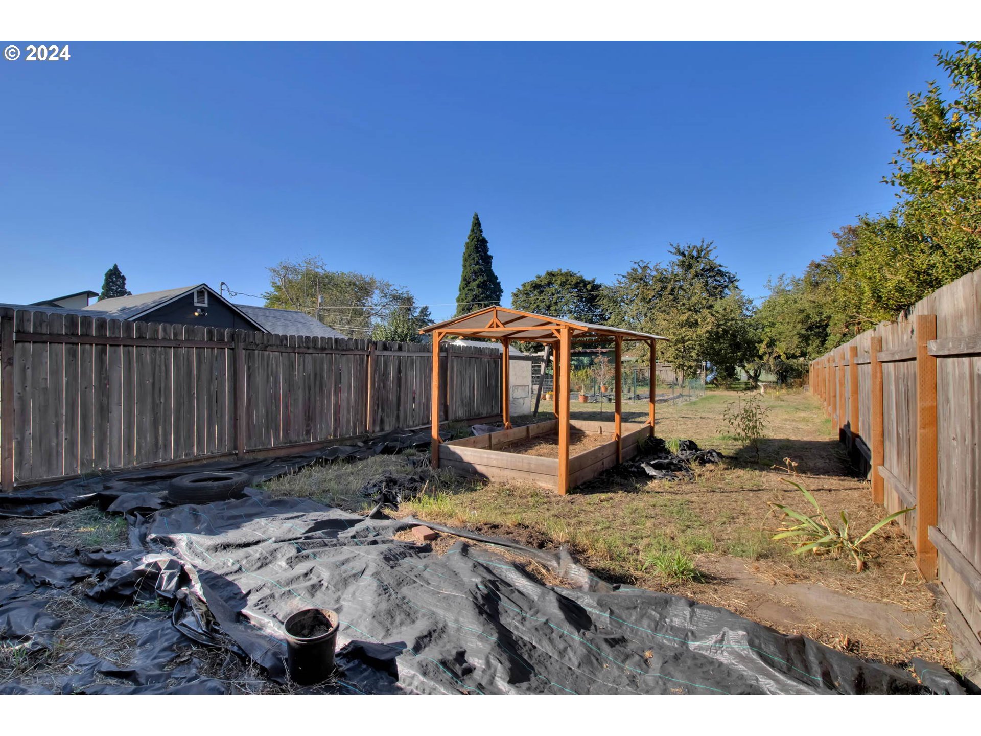 3455 Concord Street Eugene, OR 97402 - Photo 43 of 47 a view of a backyard with wooden fence