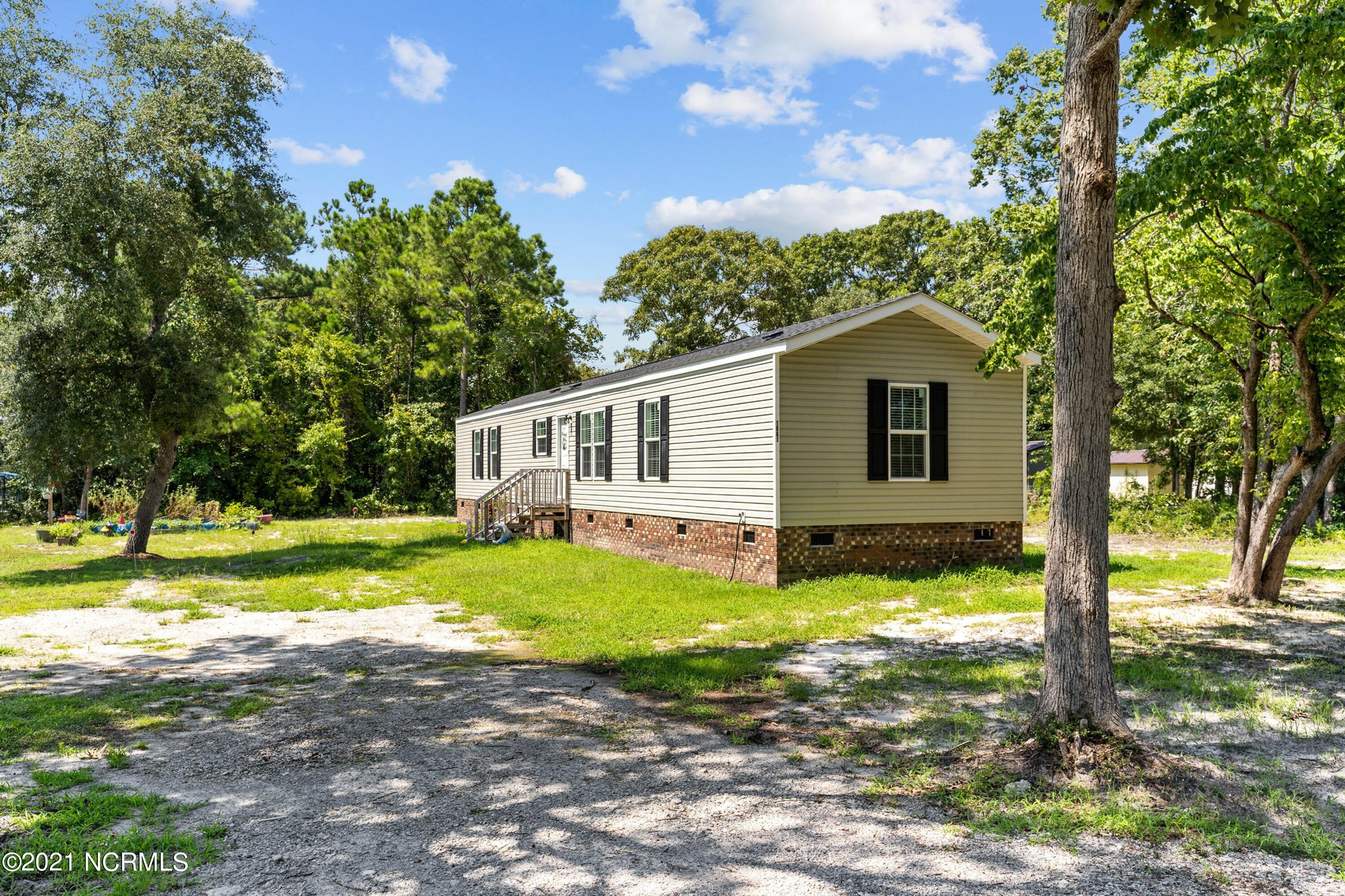 1861 Oxpen Road Southwest Supply, NC 28462 - Photo 25 of 36 Front of House from Rd