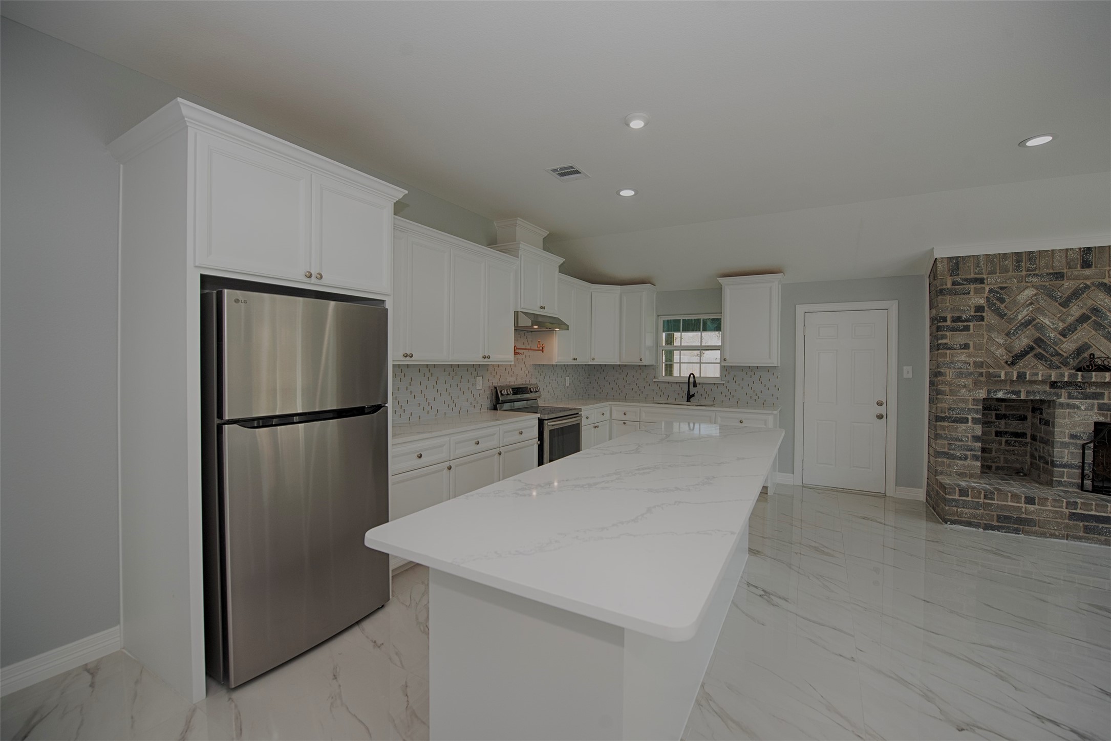 13235 Rampchester Lane Houston, TX 77015 - Photo 10 of 41 a kitchen with stainless steel appliances a refrigerator and a stove