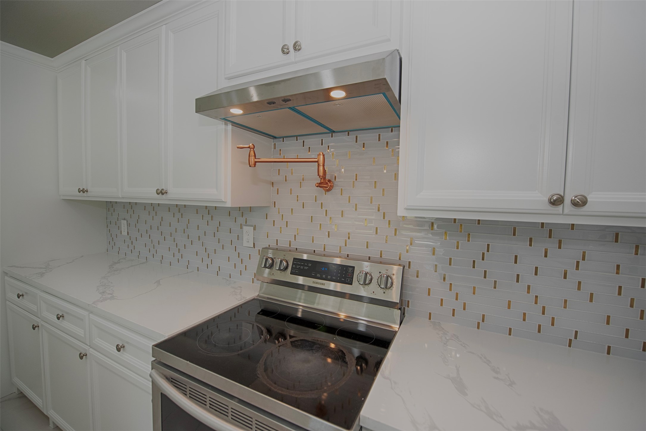 13235 Rampchester Lane Houston, TX 77015 - Photo 12 of 41 a kitchen that has a stove and a microwave