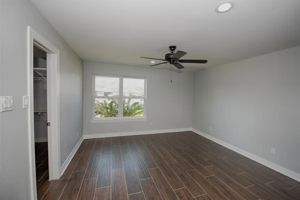 a view of room with hardwood floor and window