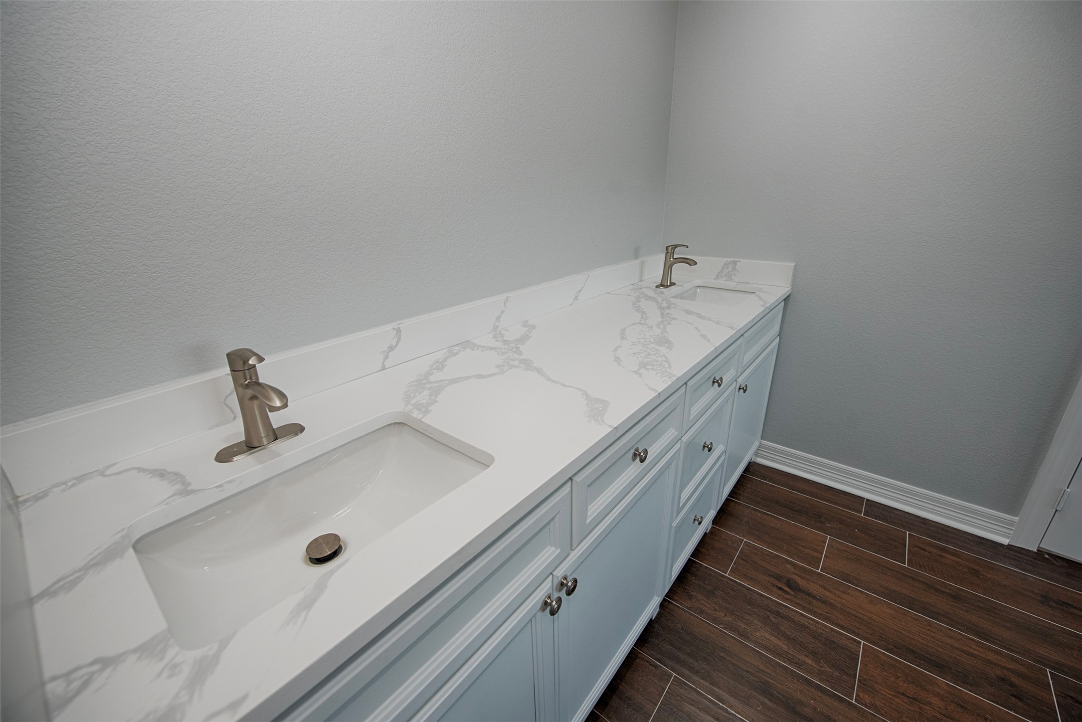 13235 Rampchester Lane Houston, TX 77015 - Photo 19 of 41 a bathroom with a double vanity sink and mirror