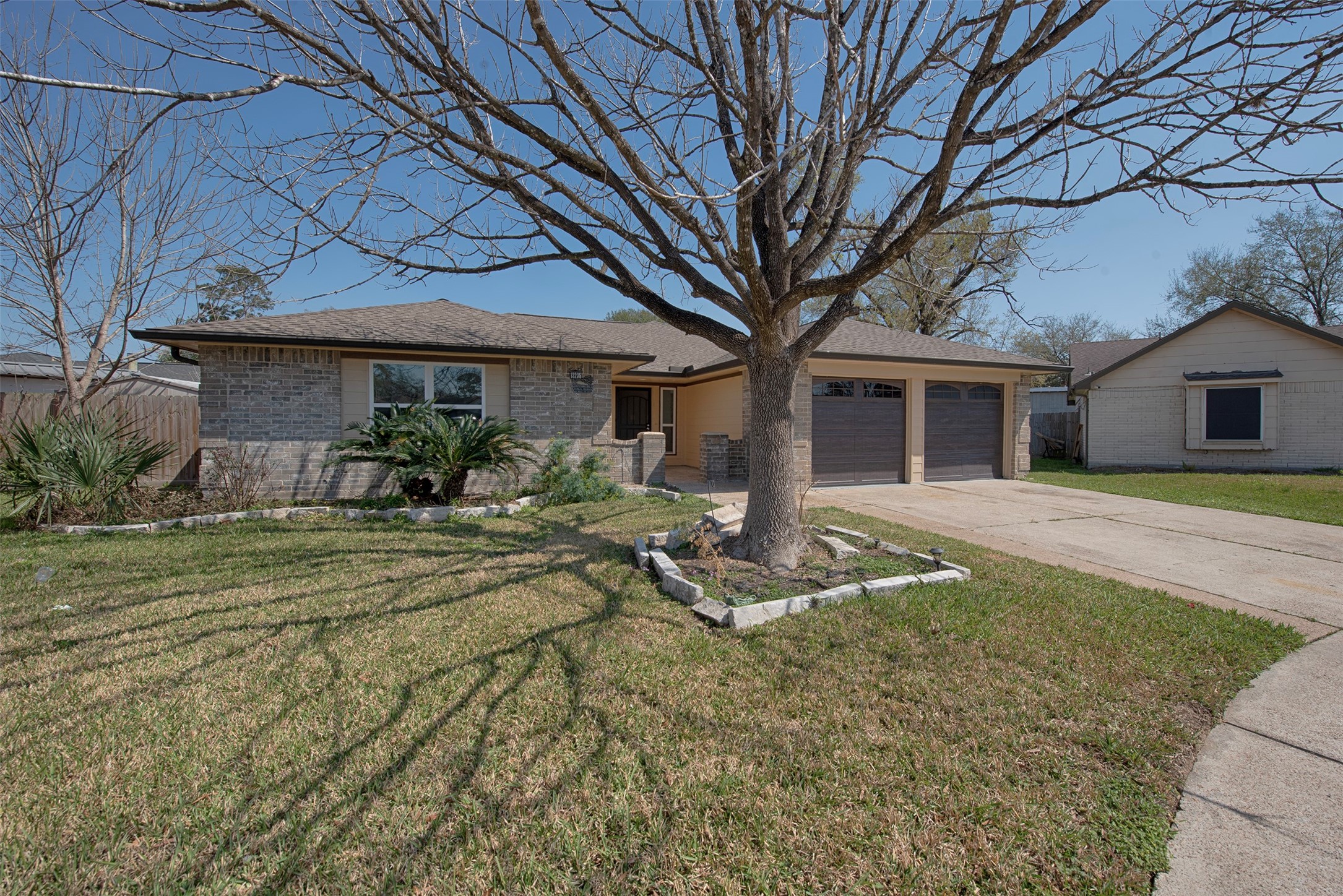 13235 Rampchester Lane Houston, TX 77015 - Photo 2 of 41 front view of a house with a tree in front of it