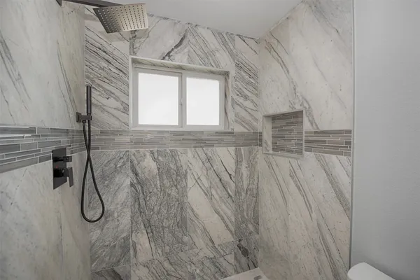 a view of a door and a window