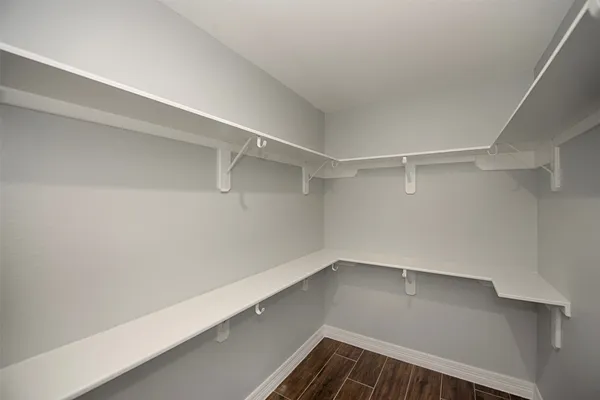a view of an empty walk in closet
