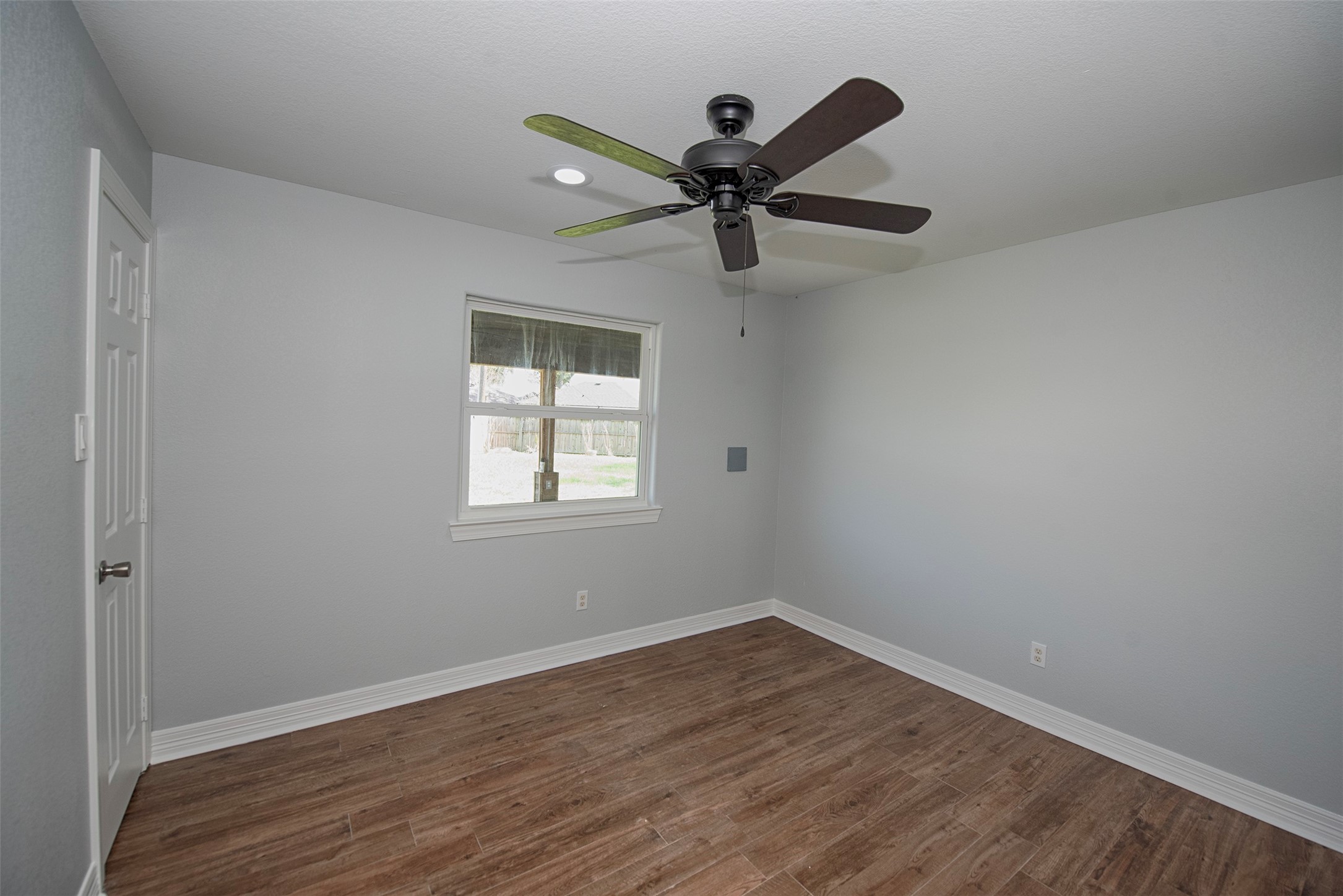 13235 Rampchester Lane Houston, TX 77015 - Photo 27 of 41 wooden floor in an empty room with a window