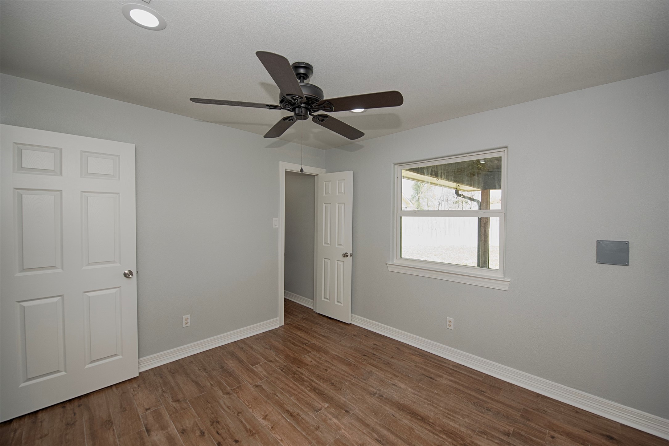 13235 Rampchester Lane Houston, TX 77015 - Photo 28 of 41 a view of an empty room with wooden floor and a window