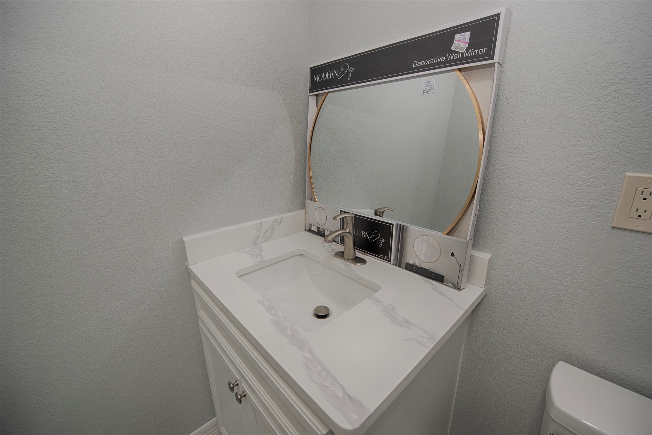 13235 Rampchester Lane Houston, TX 77015 - Photo 31 of 41 a bathroom with a sink toilet and mirror