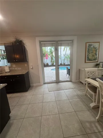 a spacious bathroom with a tub sink and mirror